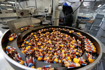 Playmobil figures are seen on the production line at the Playmobil Malta factory in the Hal Far Industrial Estate outside Valletta
